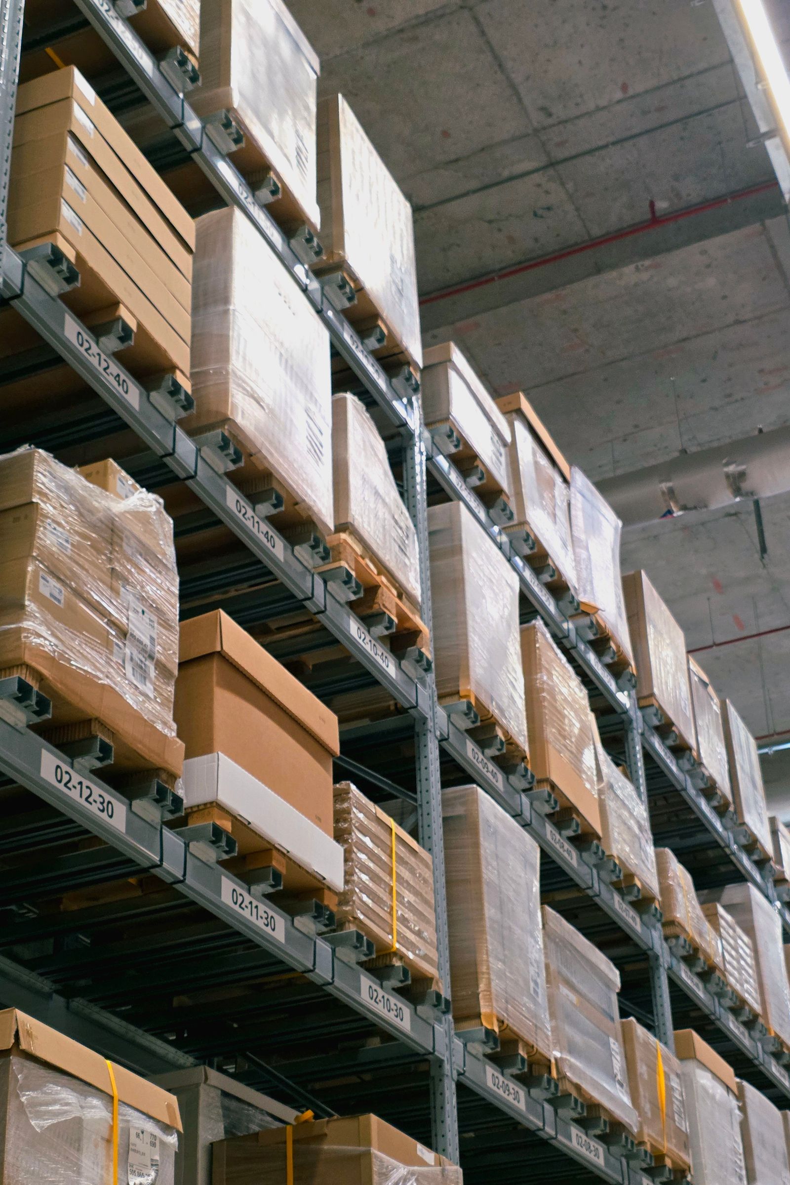 Stretch-wrapped pallets on warehouse racking